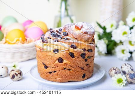 Craffin (cruffin) With Raisins And Candied Fruits. Easter Bread Kulich And Painted Eggs. Easter Holi