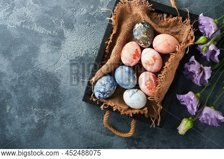 Easter Eggs. Dyed Easter Eggs With Marble Stone Effect Ref And Blue Color In Rustic Style On Dark St