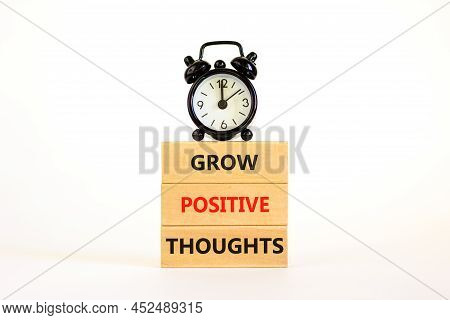 Grow Positive Thoughts Symbol. Concept Words Grow Positive Thoughts On Blocks. Beautiful White Backg