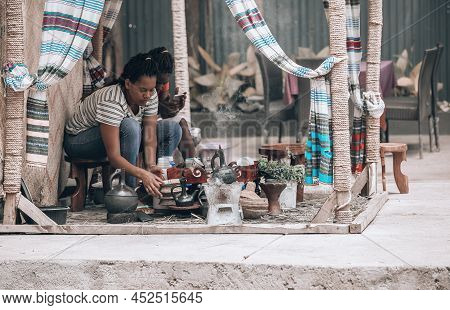 Jinka, Southern Nations Ethiopia - May 16, 2019: Local Ethiopian Woman Prepare Traditional Bunna Cof