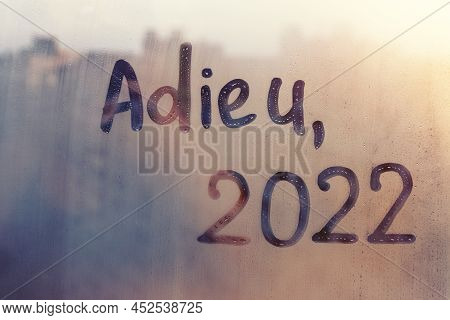 Lettering Adieu In French Is Goodbye In English And Numbers 2022 Paint With Finger Of Water On Splas