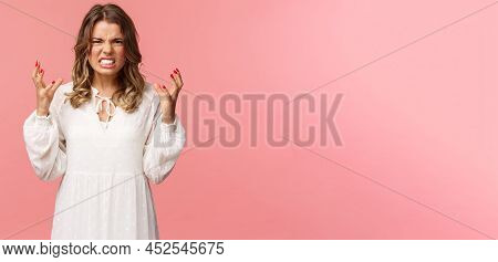 Portrait Of Woman Losing Control Over Emotions, Feel Pressured And Tensed, Lose Temper, Clench Hands