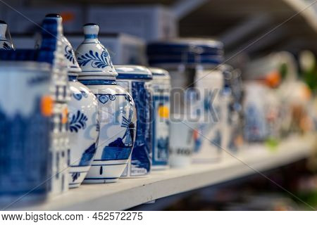 Amsterdam, Netherlands, April 2022. Close Up Of Souvenirs Of Delft Blue Pottery.