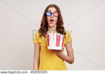 Astonished Young Female In 3d Imax Glasses Watching Movie Film, Hold Popcorn, Watching Amazing Movie