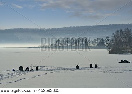 Russia. The South Of The Krasnoyarsk Territory. In The Early Winter Morning, Fishermen Are Fishing O