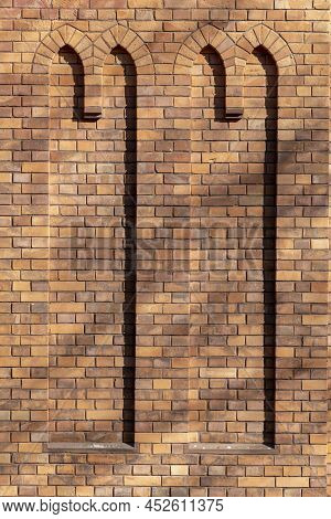 Old Red Brickstone Wall With Dummy Windows In Arabic Style Like A Mosque