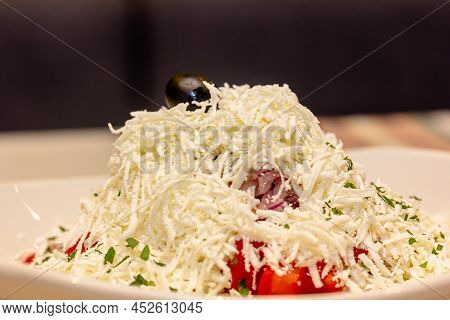 Traditional Bulgarian Shopsky Salad Is On A Plate