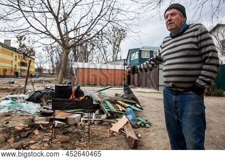 Bucha, Ukraine - Apr. 06, 2022: Local Residents Of Bucha From Apartments And Houses Destroyed By The