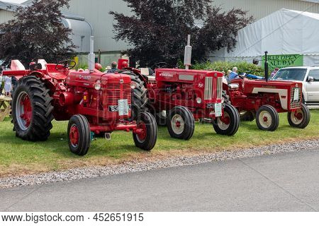 Honiton.devon.united Kingdom.july 2nd 2021.a Row Of Vintage Mccormick Tractors Is On Display At The 