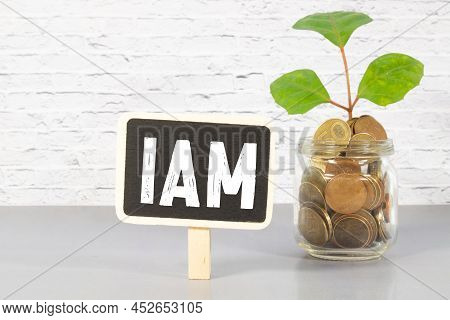 Closeup On Businessman Holding A Card With Iam Identity And Access Management Message, Business Conc