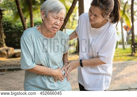 Sick Asian Senior Woman With Belly Pain,elderly Have Severe Stomach Ache,left Side,patient With Acut