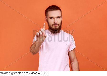 Portrait Of Bearded Man Warning Of Mistake, Looking At Camera With Admonishing Finger And Alarming, 