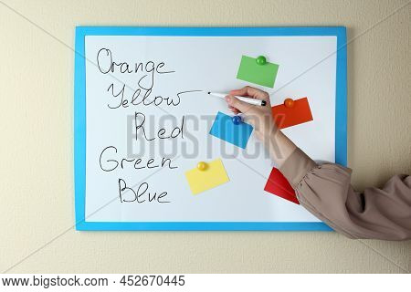 Woman Matching Colors On White Board, Closeup. Aba Therapy Concept
