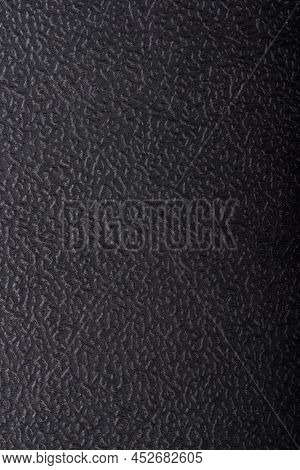Black embossed plastic texture. Shagreen background