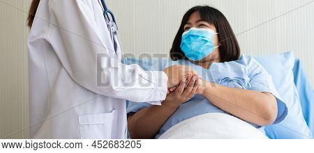 Women Asian Doctors Hold The Patient Hand And Encourage And Provide Medical Advice While Checking Th