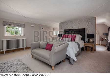 Fen Drayton, England - June 7 2018: Luxury Furnished Bedroom Suite With Bed And Sofa