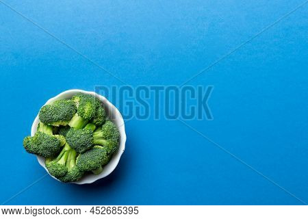 Broccoli Of Fresh Green Broccoli In Bowl Over Coloredbackground. , Close Up. Fresh Vegetable.