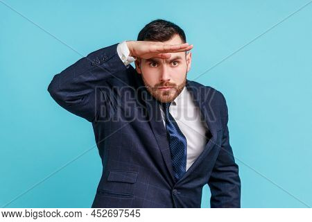 Far Future. Portrait Of Handsome Man Wearing Official Style Suit Looking Into Distance, Holding Hand