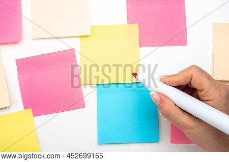 Hand Written Notes Red Marker Sticker Notes Paper. Hand With Red Marker Ready To Write. Many Colored