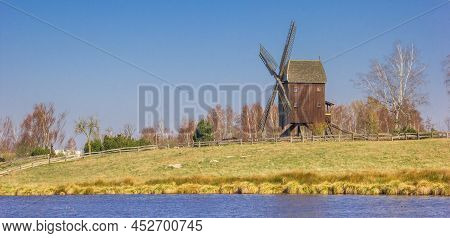 Panorama Of A Historic Wooden Windmill At The Lake In Gifhorn, Germany