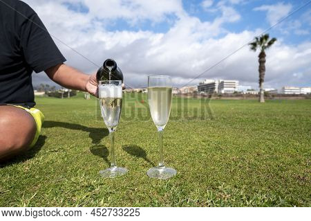Celebration Of Championship With Glasses Of Champagne Bubbles Wine On Green Lawn Of Golf Club