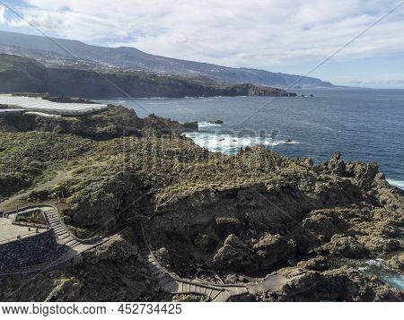 Aerial View On Charco Del Viento Natural Pool In Black Lava Rocks On Tenerife, Canary Islands, Spain