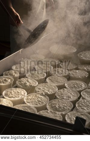 Process Of Making Fresh White Soft Ricotta Whey Cheese On Small Cheese Farm In Parma, Italy