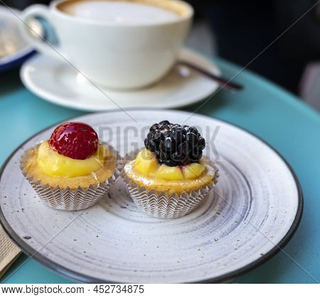 Mini Fruit Italian Cupcakes With Fresh Berries On Board