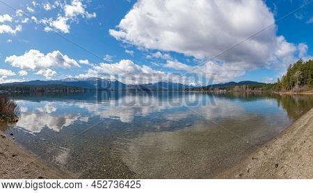Scenic view from Sproat Lake provincial park with mountain and cloudscape in Vancouver Island, BC, Canada