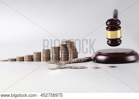 Judicial Gavel And Stacks Of Coins And Financial Crimes. Judgments Or Auction Concept