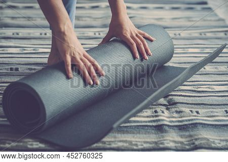 Healthy Fitness Woman Hands Rolling Up Mat After Exercise On Floor In Living Room, Woman Doing Exerc