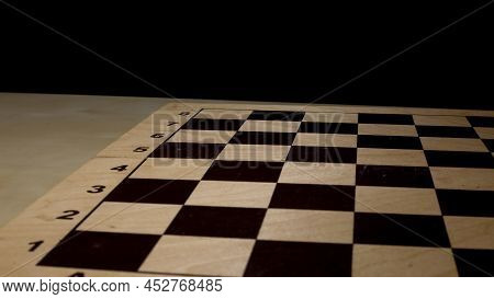 Shabby Folding Wooden Chessboard. Playing Chess With Wooden Lacquered Pieces. Black And White Square