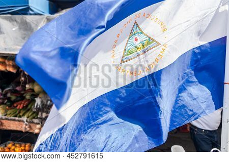 Nicaraguan Flag Waving At A Local Market In Boaco Nicaragua