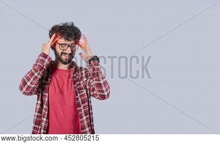 Concept Of A Man With A Headache, Man Rubbing His Head On Isolated Background, Guy Giving Himself A