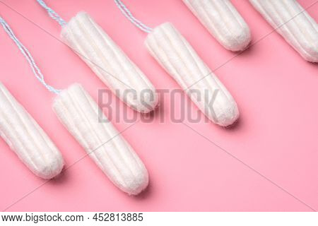 Medical Female Tampon On A Pink Background. Hygienic White Tampon For Women. Cotton Swab. Menstruati