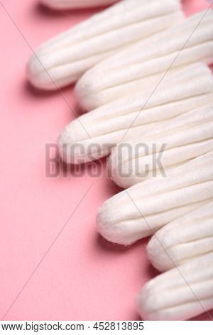 Medical Female Tampon On A Pink Background. Hygienic White Tampon For Women. Cotton Swab. Menstruati