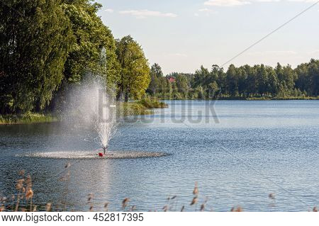 Fountain In The Lake, Water Pours From The Pipes, Splashes Of Water On The Lake, Aluksne, Latvia