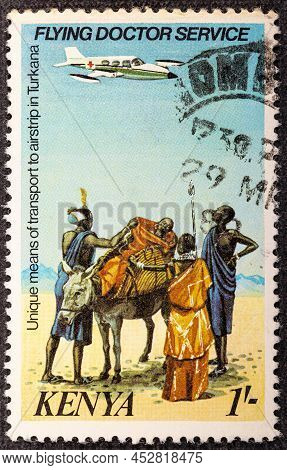 Kenya - Circa 1980. Kenyan Stamp From The Series Flying Doktor Cervice. Mule Transporting A Patient.