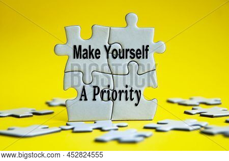 Make Yourself A Priority Text On Jigsaw Puzzle With Yellow Background. Motivational Concept