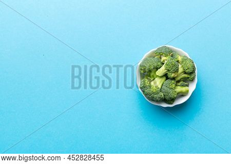 Broccoli Of Fresh Green Broccoli In Bowl Over Coloredbackground. , Close Up. Fresh Vegetable.