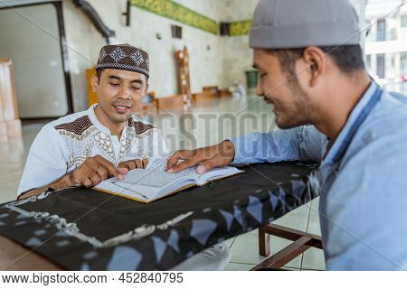 Man Muslim Learing To Reading Quran Together During Ramadan