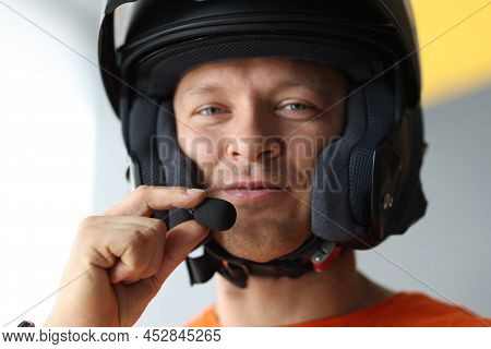 Portrait Of Male Wearing Helmet With Microphone For Hands Free Connection, Interphone For Motorcycli