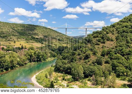 Tandem Of Contemporary Architecture And Eternal Green Nature. Millau Viaduct And Tarn Valley With It