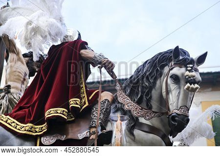 Elche, Spain- April 13, 2022: Easter Parade With Bearers And Penitents Through The Streets Of Elche 