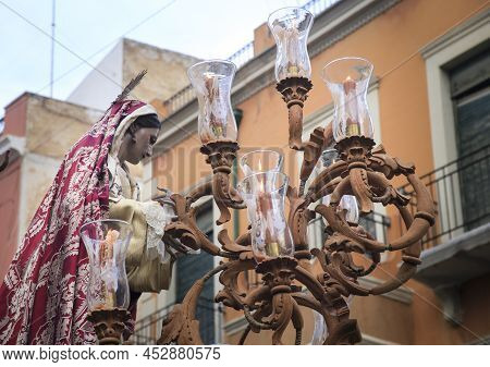 Elche, Spain- April 13, 2022: Easter Parade With Bearers And Penitents Through The Streets Of Elche 