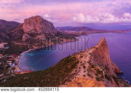Pink Sunset In Novyi Svit In Autumn With Mount Falcon In Background. Sudak, The Republic Of Crimea. 