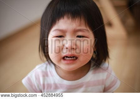 Image Of A Girl Crying At Home