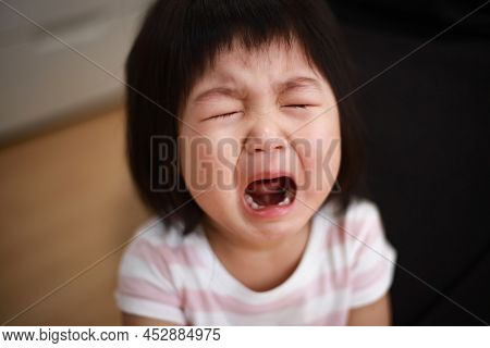 Image Of A Girl Crying At Home