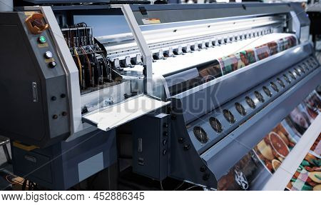 Wide Format Inkjet Printer Working On Glossy Poster. Advertising Industry.