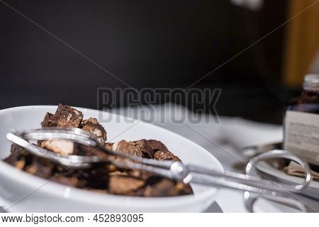 Close-up Of Chocolate Cake Pieces In Bowl On Counter At Ski Resort
